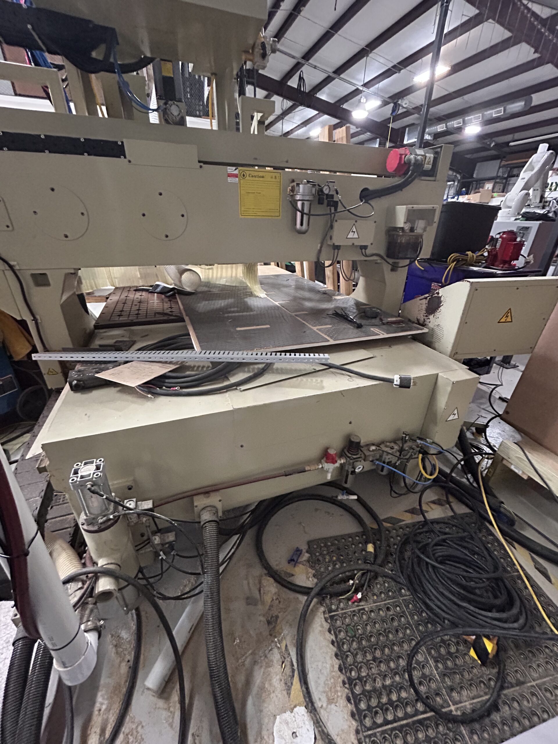2000 Anderson Stratos SUP CNC Router - Rear View Rear view of the 2000 Anderson Stratos SUP CNC Router showing the gantry, rear machine frame, cable management, pneumatic components, and overall machine condition.