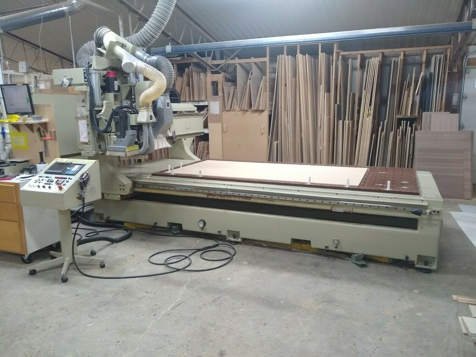 2000 Anderson Stratos SUP CNC Router - Left Side View 2000 Anderson Stratos SUP CNC Router showing the left side of the machine, 5' × 10' vacuum table, gantry, and overall machine condition.